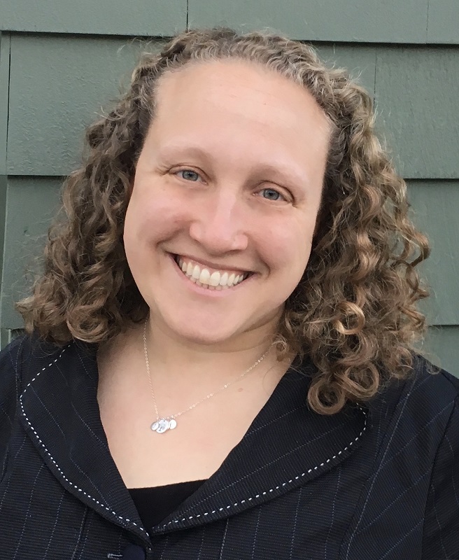 collective: Gretchen Brion-Meisels (headshot), lecturer at Harvard Graduate School of Education, smiling woman with curly light brown hair, necklace in dark outfit