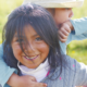 early child care for native families grants; young native girl playing with sibling on back