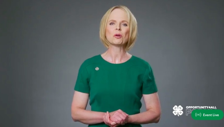 4-H: Blonde woman in green top speaks on screen