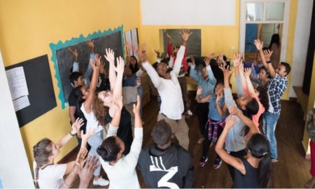 Manhattan Arts Education Creative Learning grants; class being led by black male teacher