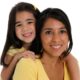 Native Community domestic violence grants; native mom and daughter smiling at camera