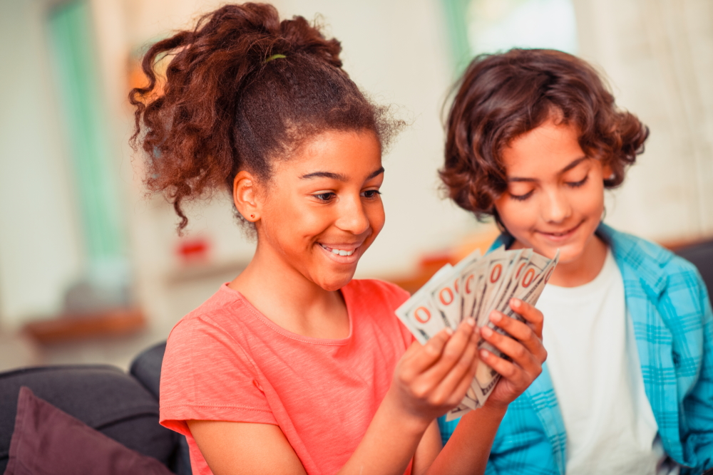 oster youth: smiling girl holding money