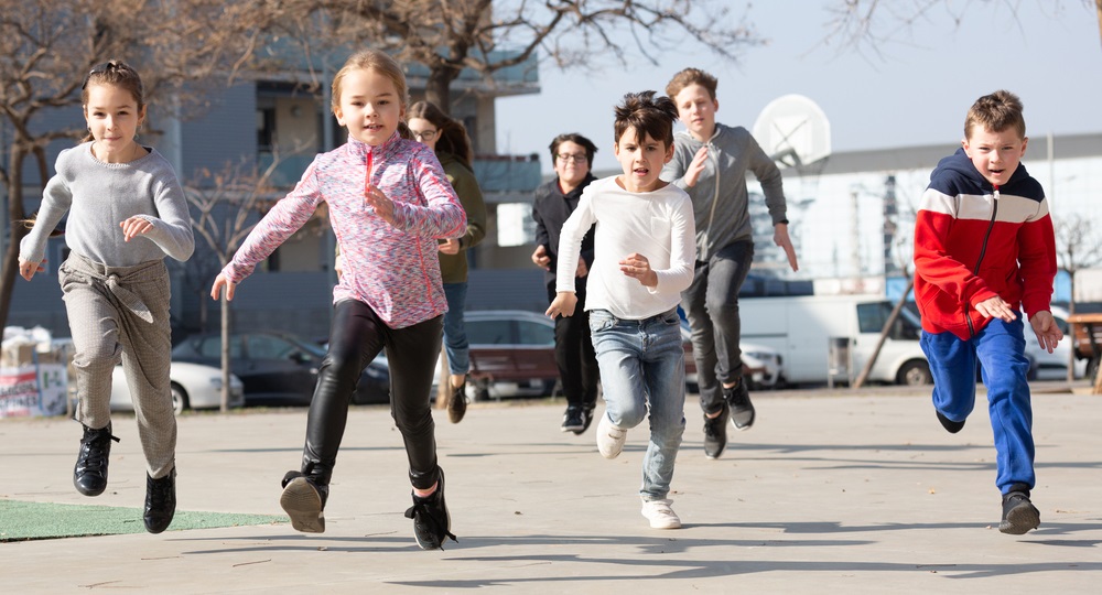 Kids outdoors running