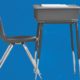 rethinking role of juvenile justice system report; graphic of school desks on blue background