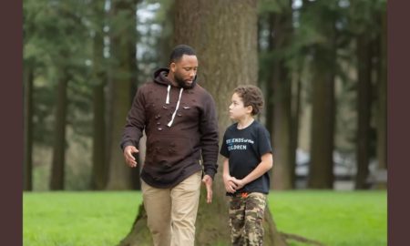 Pacific Northwest Disadvantaged Youth Development Program grants; mentor and child walking in outdoors while talking