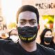 black lives matter protester with mask on
