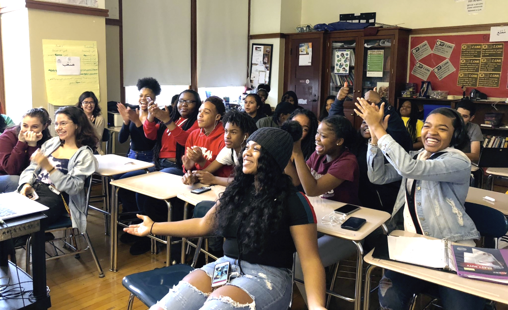 Stevens Initiative: Smiling female students in classroom applaud. 