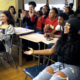 Stevens Initiative: Smiling female students in classroom applaud.