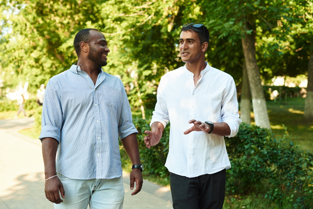 philanthropy: Two black men talking outside