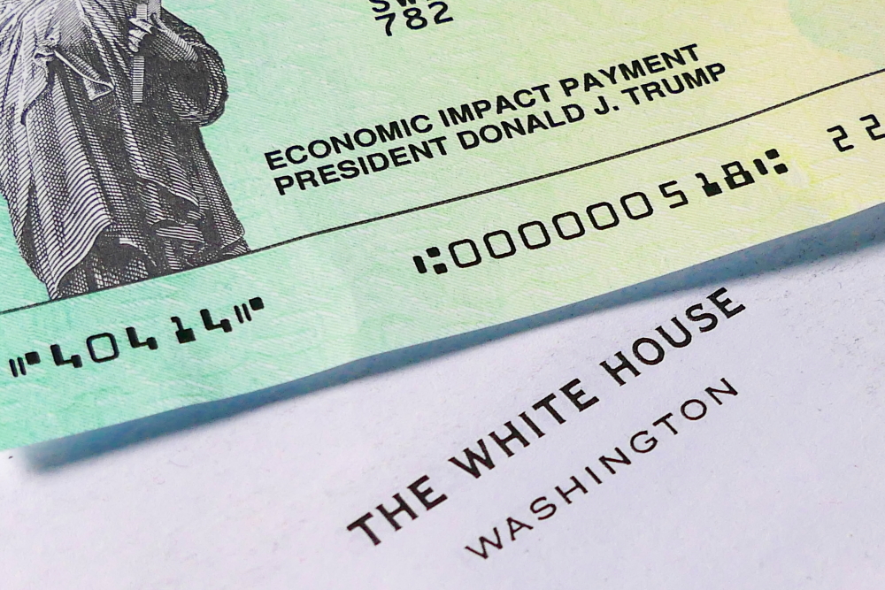 stimulus: An Economic Impact Payment check from President Donald Trump and letter from White House. 