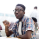 Mental health of Black LGBTQ youth report; photo of black, LGBTQ teen in classroom