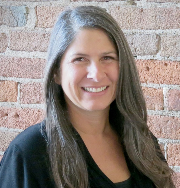 Jocelyn Wiedow (headshot), network and quality coordinator for Sprockets, smiling woman with long gray hair, black top