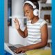 2020 children's mental health report; young black girl on laptop with headphones on smiling and waving