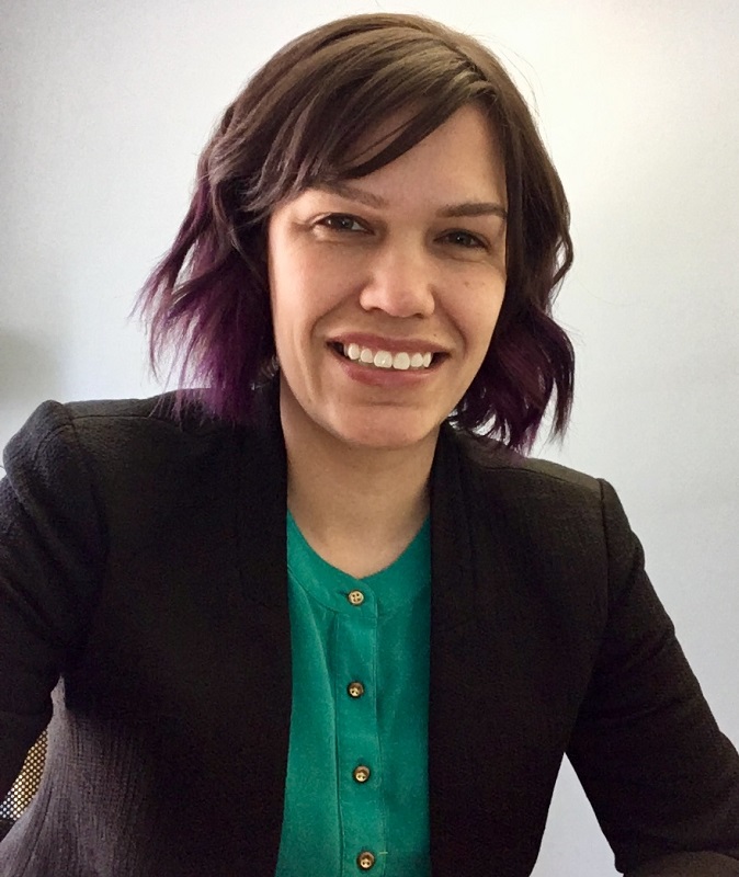 trauma: Sarah Gonzalez Bocinski (headshot), program manager at Futures Without Violence, smiling woman with purple-tipped brown hair, black jacket, green top