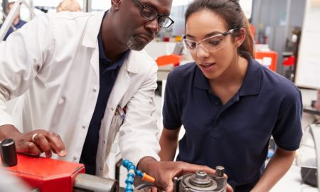 apprenticeship: Engineer showing equipment to a female apprentice