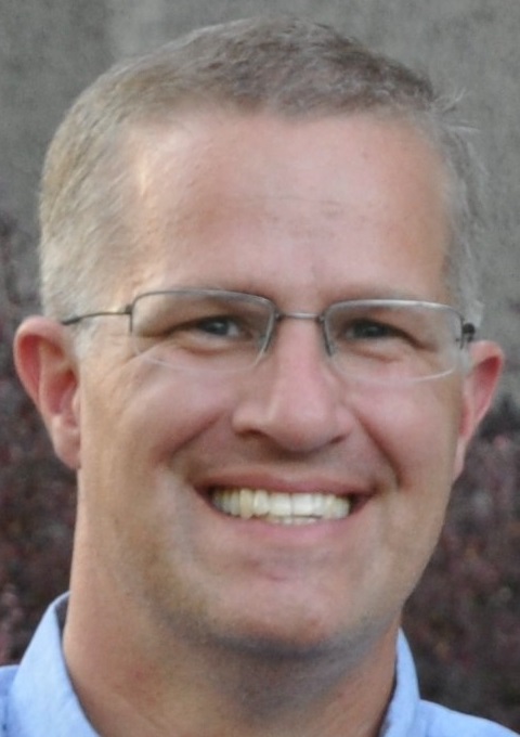 college and career: Matthew Ward (headshot), high school special education teacher, smiling man with short blond hair, glasses, light blue shirt