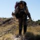 community-based conservation and sustainability during and after covid grants; image of hiker in dry landscape
