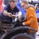 vehicle restoration/preservation youth education and training program grants; two young people working on antique car