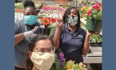 Delaware community nonprofit support grants; three nursery workers with masks on posing for camera