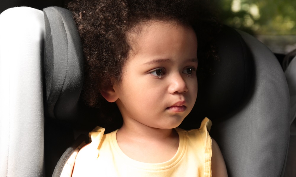 ASFA: Little African-American girl crying inside car.