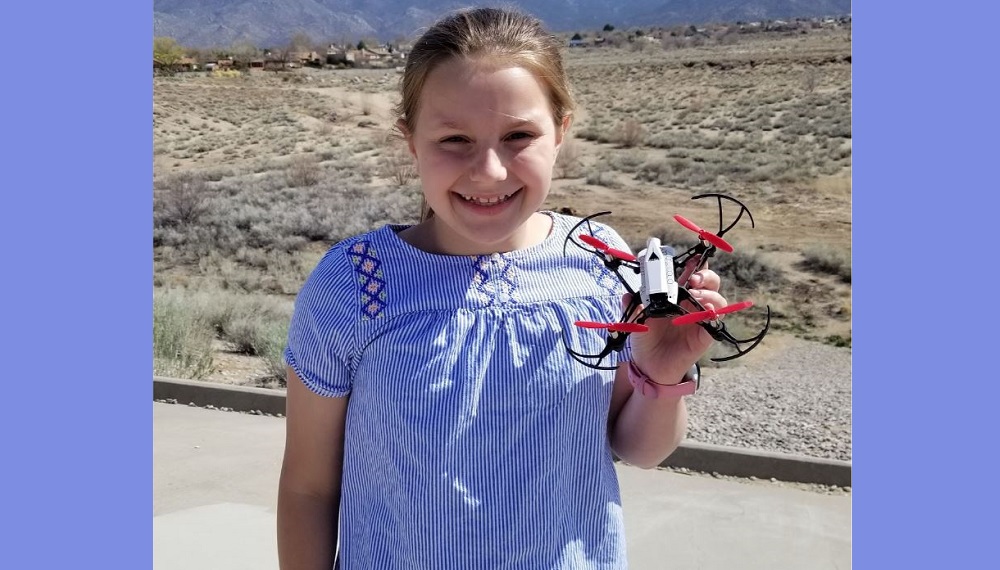 Georgia girls' STEM program; young girl holds her drone