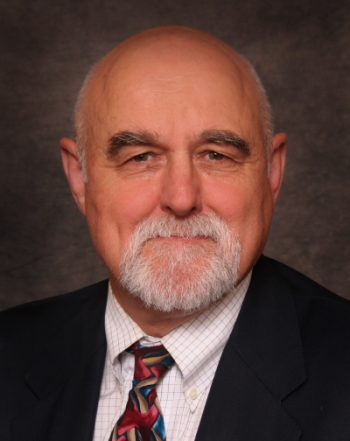 assault-style rifle: Stephen Hargarten (headshot), emergency physician, injury prevention and control scientist, balding man with gray mustache, beard, black jacket, checked shirt, patterned tie