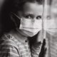 estimates and projections of COVID-19 and parental deaths in U.S. report; black and white image of sad girl in mask at window