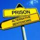 family-based alternative sentencing program grants: traffic sign with two path options; prison or alternative sentencing