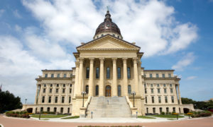 Kansas law reading skills: Kansas State Capitol builing traditional architecture cream-colored with dome centertop