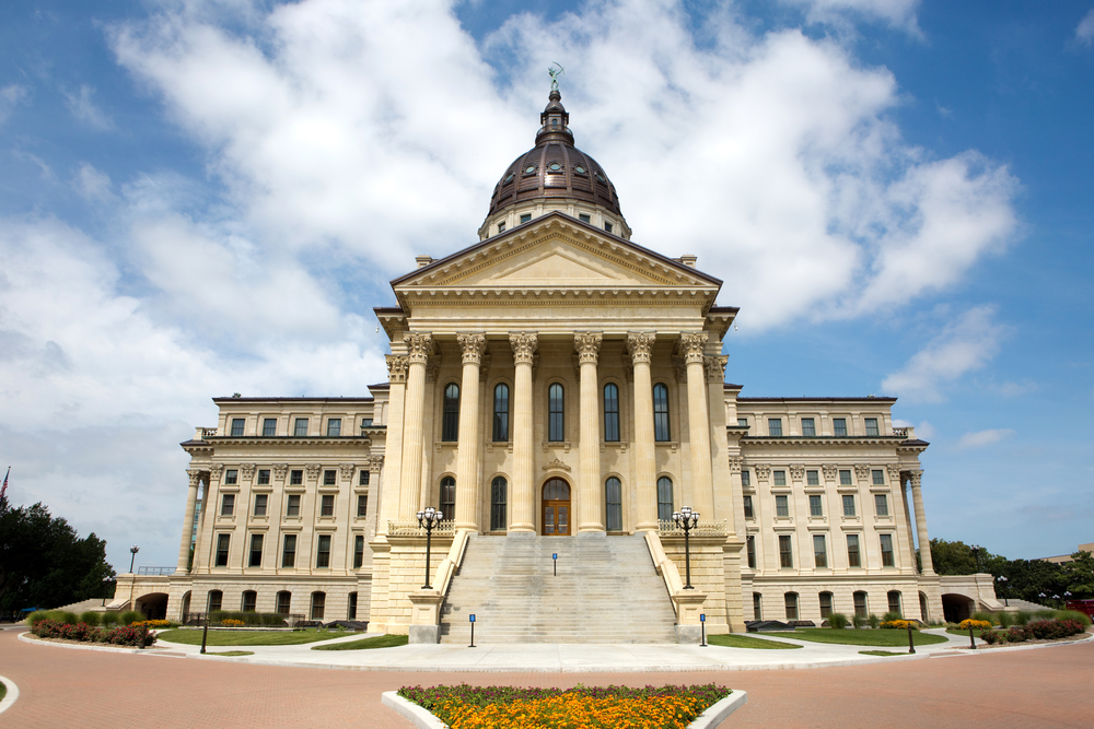 Kansas law reading skills: Kansas State Capitol builing traditional architecture cream-colored with dome centertop