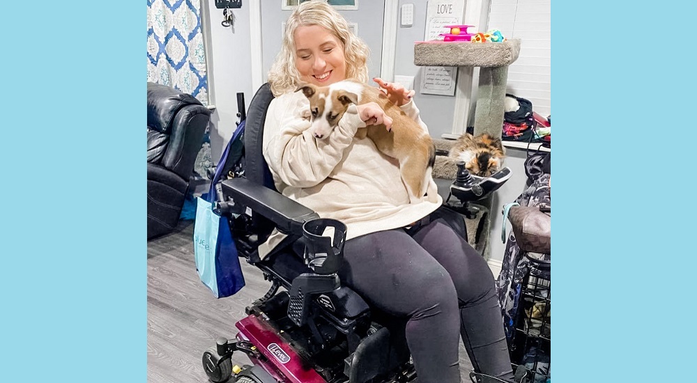 Izzie Bullock, whose severe form of cerebral palsy prevents her from controlling her arms, legs and body, receives gynecologic care at a University of Michigan Medical Center clinic designed for women with disabilities.