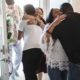 Bringing More Teens Home juvenile justice report: family welcoming home teen in doorway
