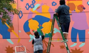 Oregon community grants: painters painting a colorful outdoor mural