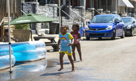 Playstreets Philadelphia: 2 young children play in the street