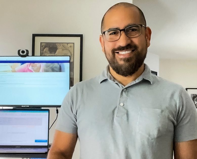 Carlos Santini is new CEO of Mizzen by Mott: photo of man in glasses with beard in front of home computer workstation