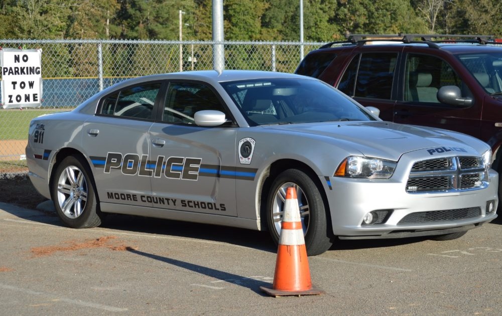 A school district added its name to police car for officers assigned to its schools,