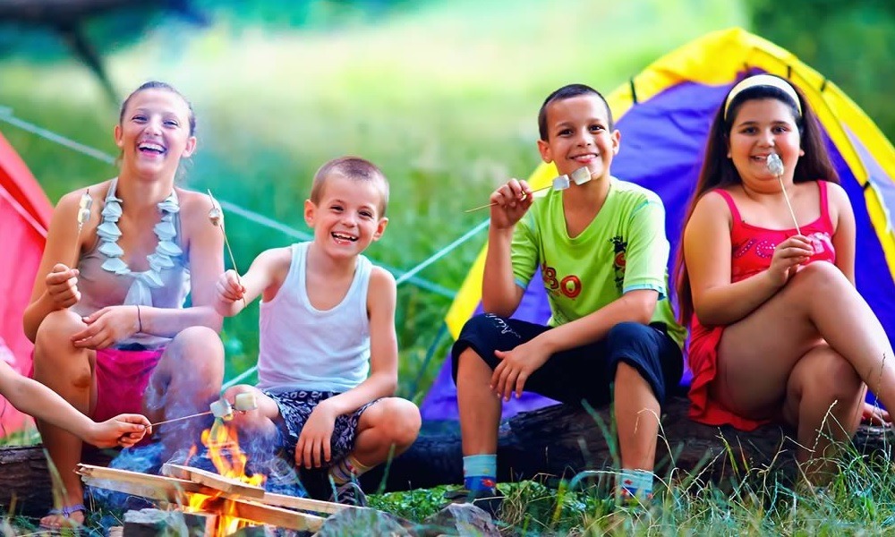 West Michigan child and youth program grants: group of happy kids at campsite