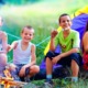 West Michigan child and youth grants: group of happy kids at campsite