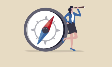 compass nonprofit leadership: illustration of dark-hared woman standing in profile wearing a business suit leaning against an over-sized compass looking through a long, hand-held telescope