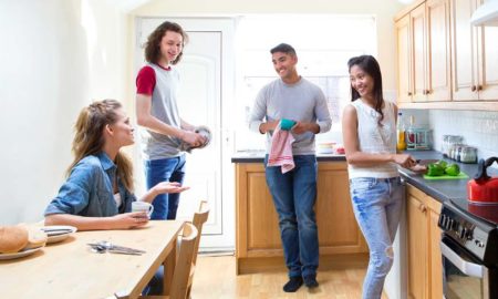 Supportive housing for former foster youth report: group of youths in a sunny kitchen together