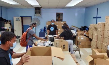 Living Redemption Youth Opportunity Hub youth, including those in the juvenile system, boxed up donated food to distribute in Harlem during COVID-19.