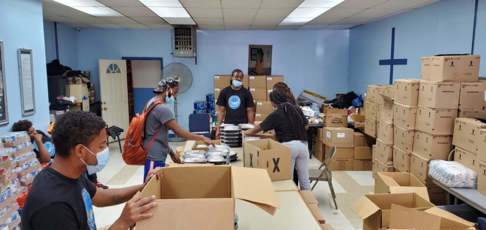 Living Redemption Youth Opportunity Hub youth, including those in the juvenile system, boxed up donated food to distribute in Harlem during COVID-19.