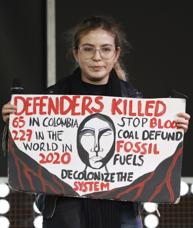 Climate COP26 Summit: Crowd of 100s with portest signs in the streets outside the conference