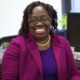 Denise Scott new president of LISC: black woman with glasses sitting in office chair smiling