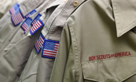 $800 million settlement in Boy Scouts sex abuse case: image of boy scout uniforms lined up