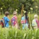 outdoor learning grants: teacher and students in backpacks out in nature