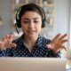 5 questions to ask when hiring consultant: young woman with headset talking on computer