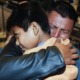 families separated at border now fear extortion: father hugging his young son tightly at reunification