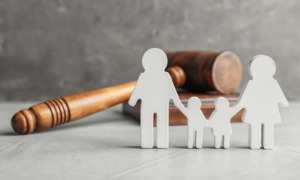 family justice and child welfare improvement program grants: gavel with stick figure family standing in front