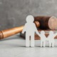 family justice improvement program grants: gavel with stick figure family standing in front